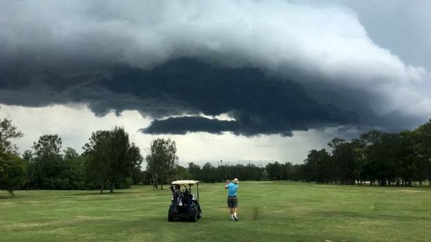 Stormclouds gather over Nudgee Golf Club yesterday.