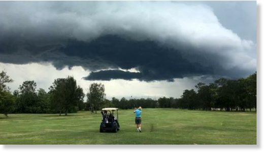Stormclouds gather over Nudgee Golf Club yesterday.