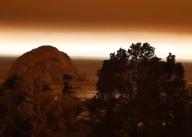 Eery apocolyptic glow seen on the horizon as Californian skies dimmed by smoke from unusual December fires