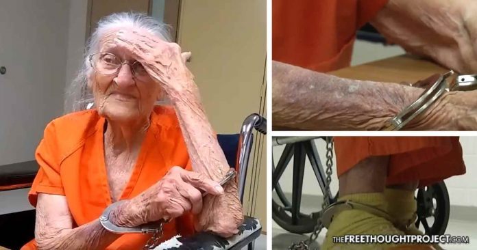 Click to enlarge old woman in handcuffs