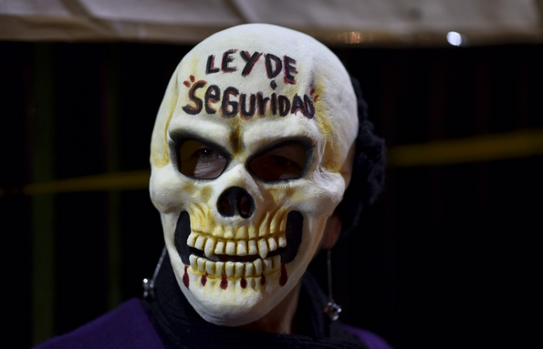 Mexico demonstrator Security Law skull mask