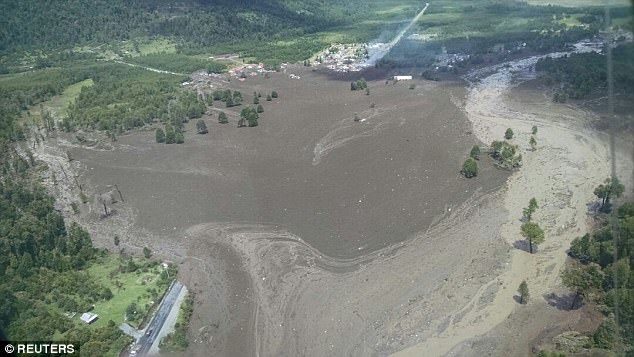 Rain caused a river to overflow and the side of a hill to collapse, burying 20 of the 200 houses in Villa Santa Lucia in the Los Lagos region