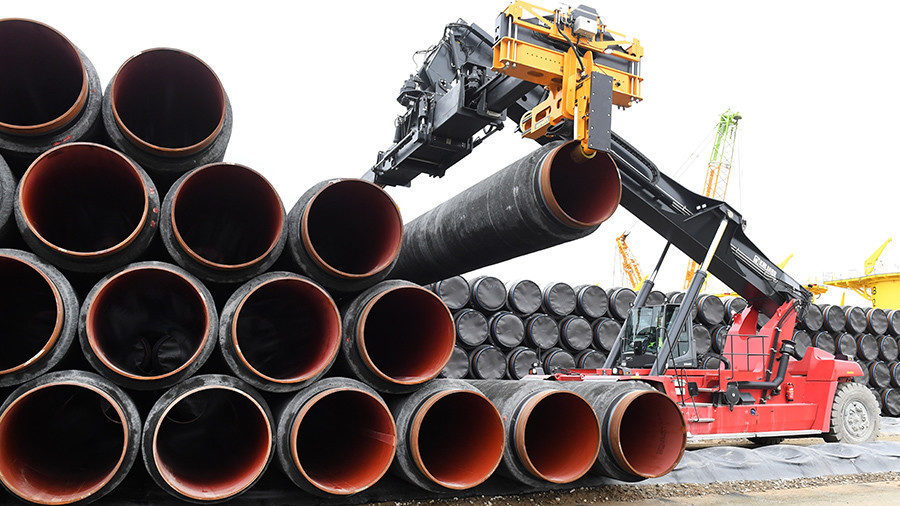 Pipes for the Baltic Sea pipeline being transported for loading onto a ship in the premises of the harbour in Mukran, Germany