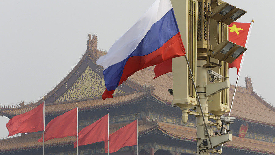 Click to enlarge Russian and Chinese national flags