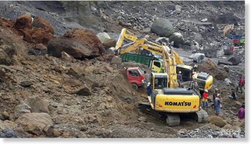 Click to enlarge Rescuers are using heavy machinery to search for survivors after the landslide on the slopes of Mount Merapi