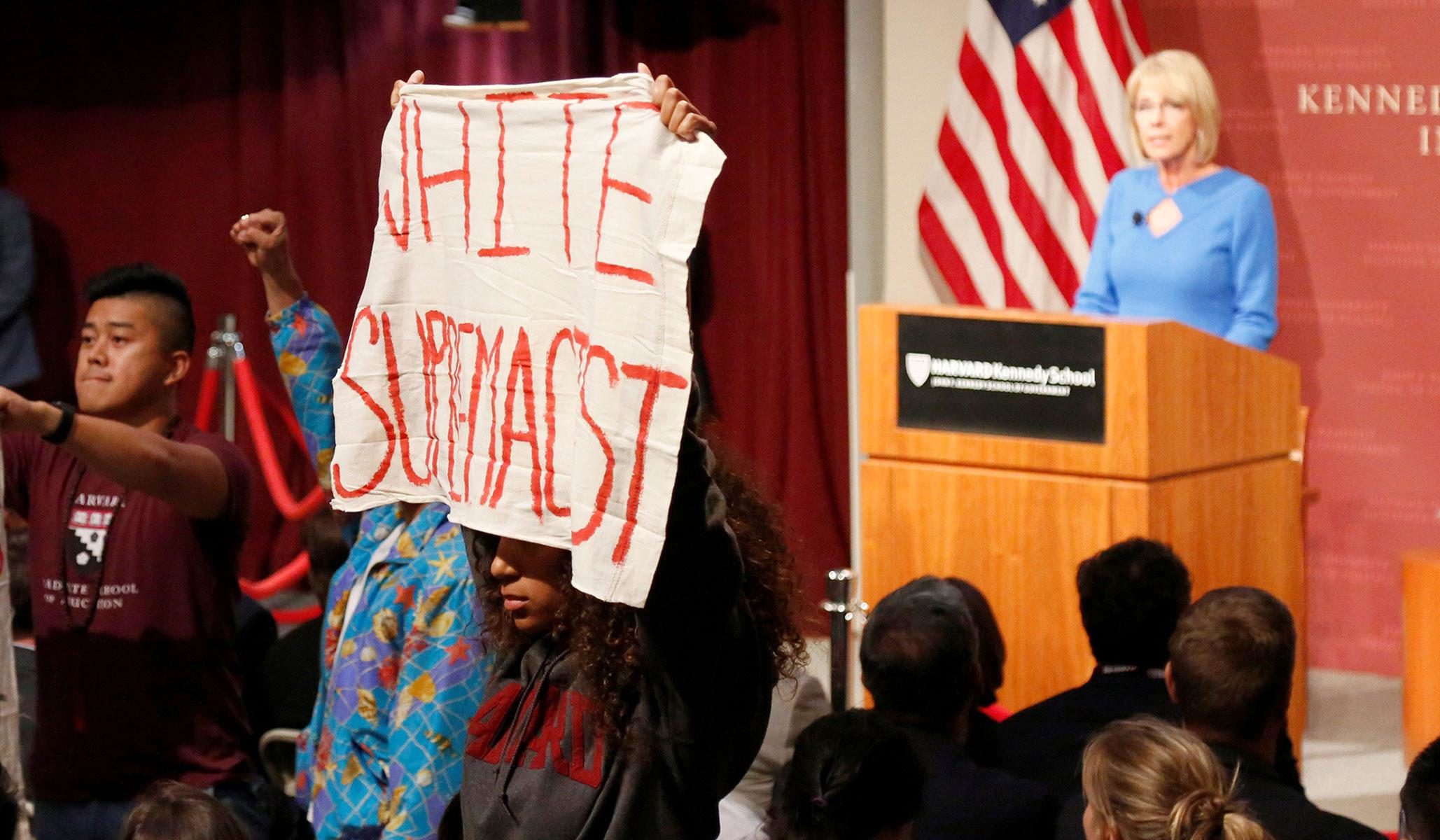 Click to enlarge Harvard University Betsy DeVos Academic Left's Radical Identity Politics white supremacy fake news protest