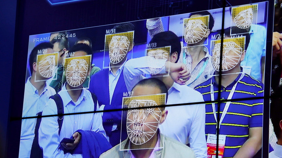 Visitors experience facial recognition technology at Facebook booth