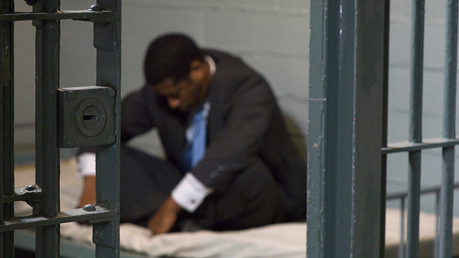 man in suit in jail
