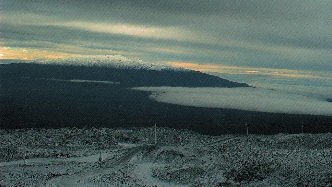 Mauna Kea, as seen from snow covered Mauna Loa