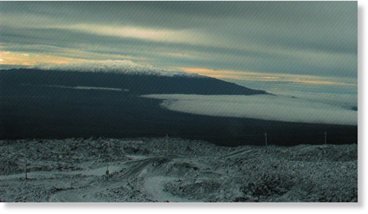 Mauna Kea, as seen from snow covered Mauna Loa