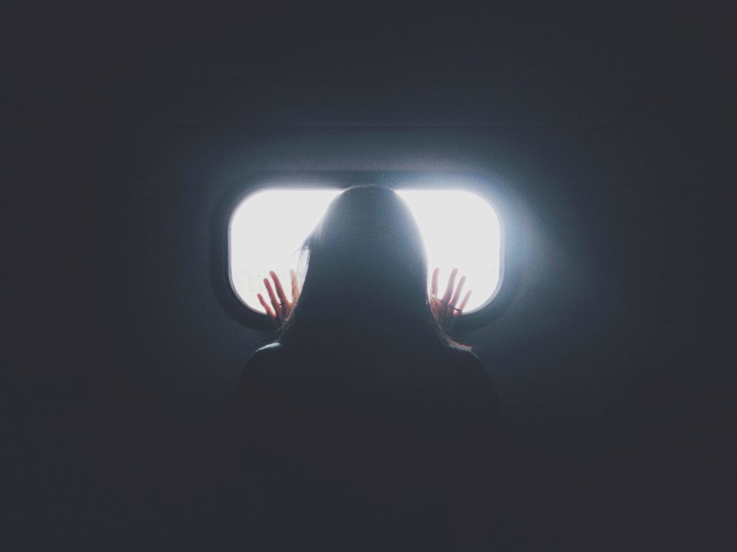 person looking through window