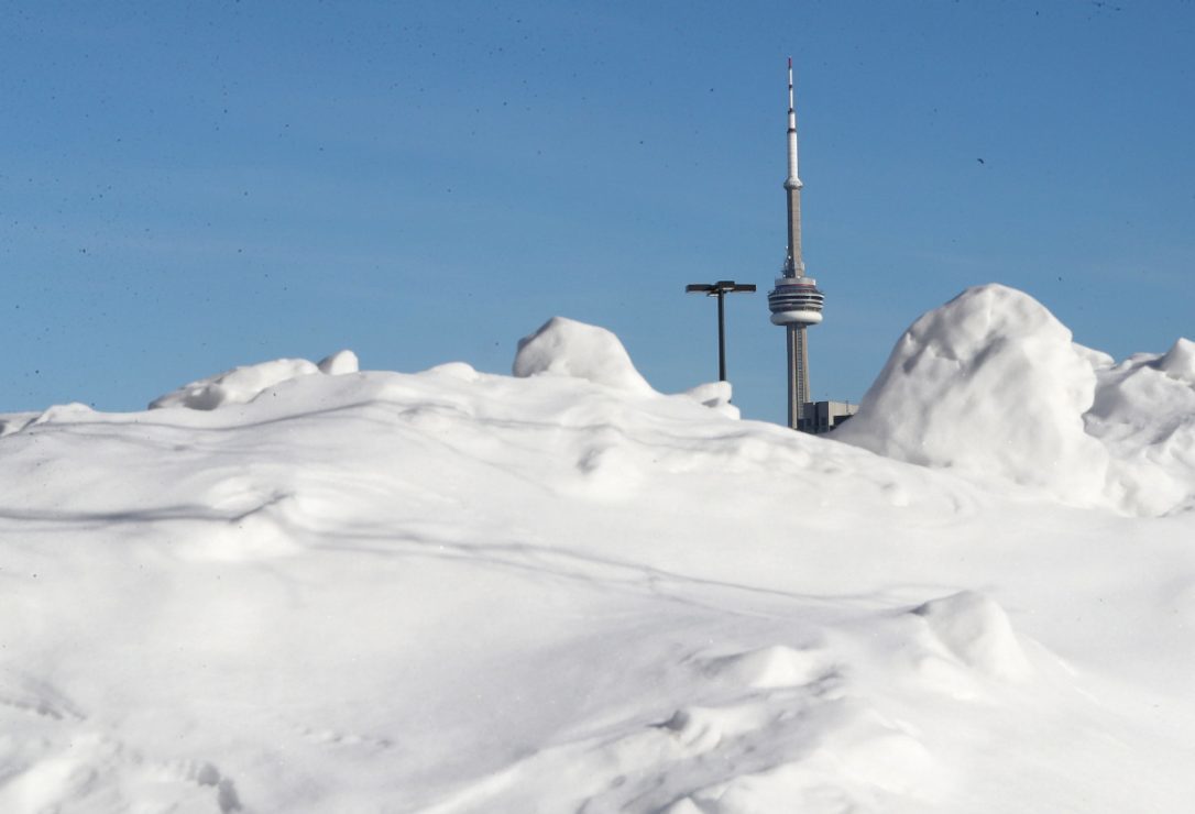 Click to enlarge Snow piles up in parking lots at the Canadian National Exhibition as Toronto tries to stay warm in the extreme cold.