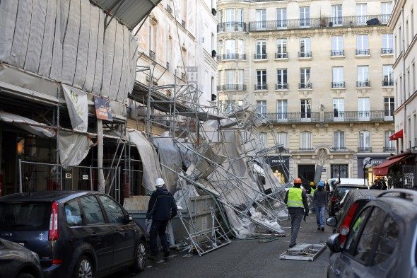 A scaffolding collapsed due to a violent windstorm, in Paris, Wednesday, Jan. 3, 2018, as France's national electricity provider reports 200,000 households without electricity across the country, including 30,000 in the Paris region due to storm damage.