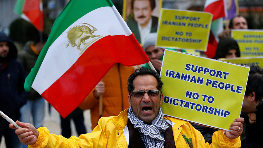 Click to enlarge An opponent of Iranian President Hassan Rouhan