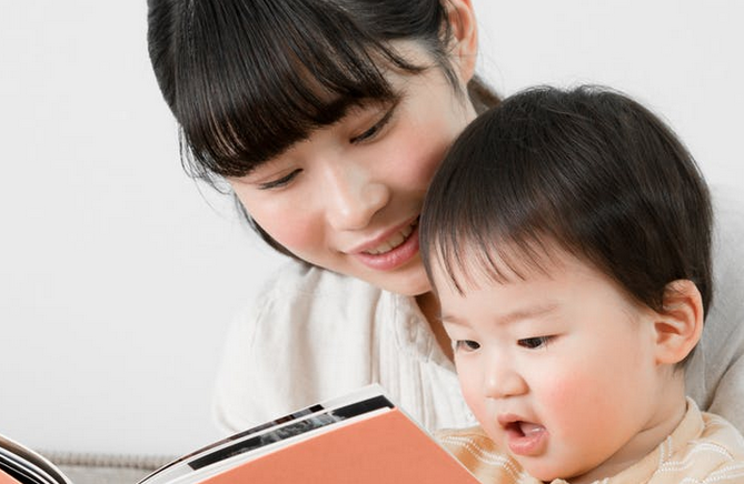 baby and parent reading