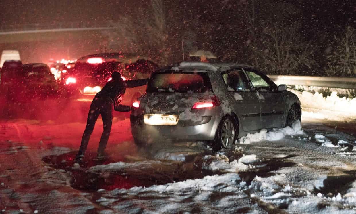 Click to enlarge A car is pushed through the snow in La Rioja, northern Spain. Motorists were advised to travel only if strictly necessary.