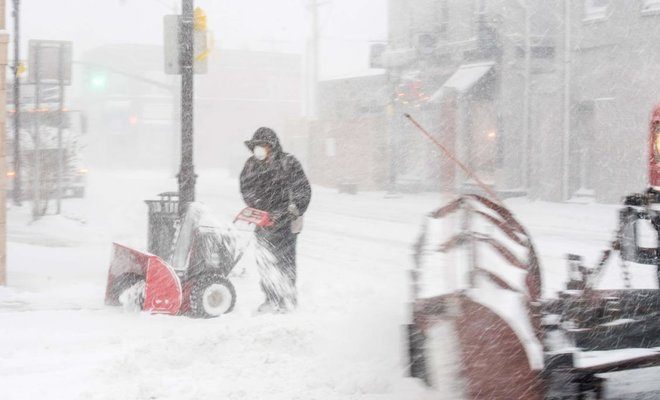 Click to enlarge “bomb cyclone” New England guy snow blowing