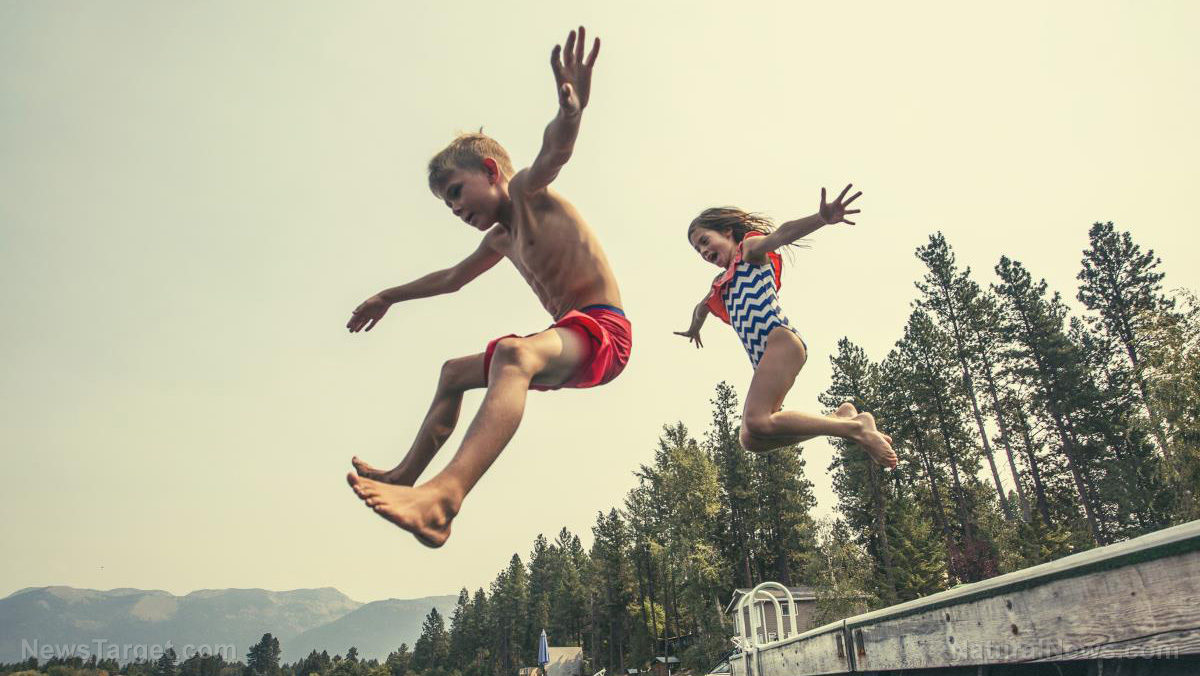 children jump off dock swimming
