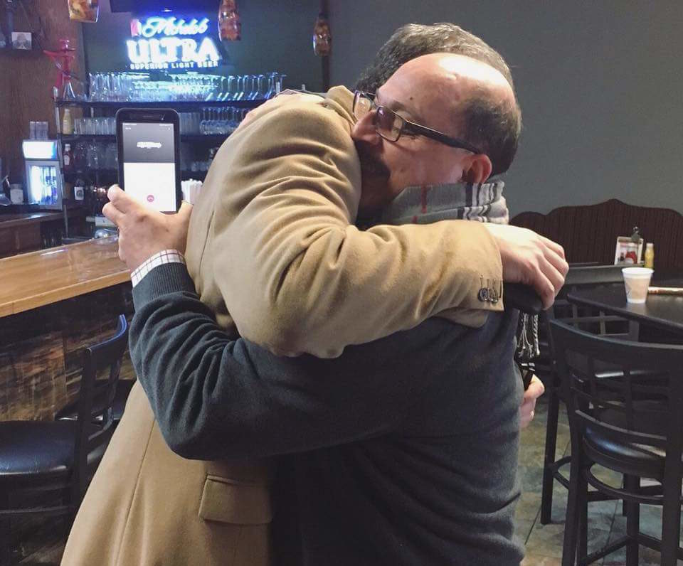 Palestinian American man Amer Othman Adi hug