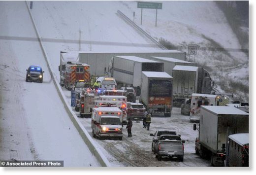 Emergency personnel remove patients for transport to area hospitals at the scene of a multi-vehicle wreck on Interstate 65 near Bonnieville, Ky., Tuesday, Jan. 16, 2018.