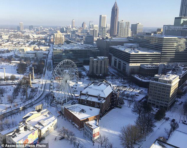 A snow covered downtown is seen, Wednesday, Jan. 17, 2018, in Atlanta.