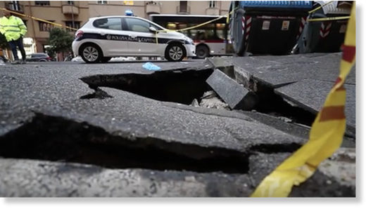 A woman was left injured after she plunged into the sinkhole