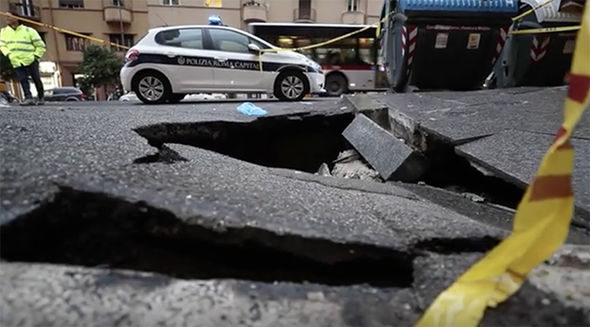A woman was left injured after she plunged into the sinkhole
