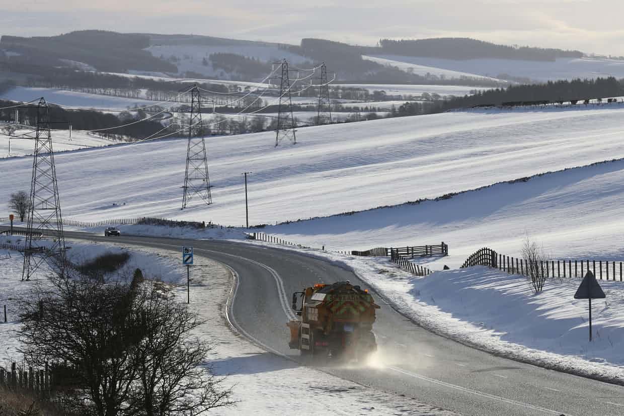 Click to enlarge A gritter lorry on the A68 in the Scottish Borders. Police have advised motorists to drive with extreme caution amid wintry conditions.