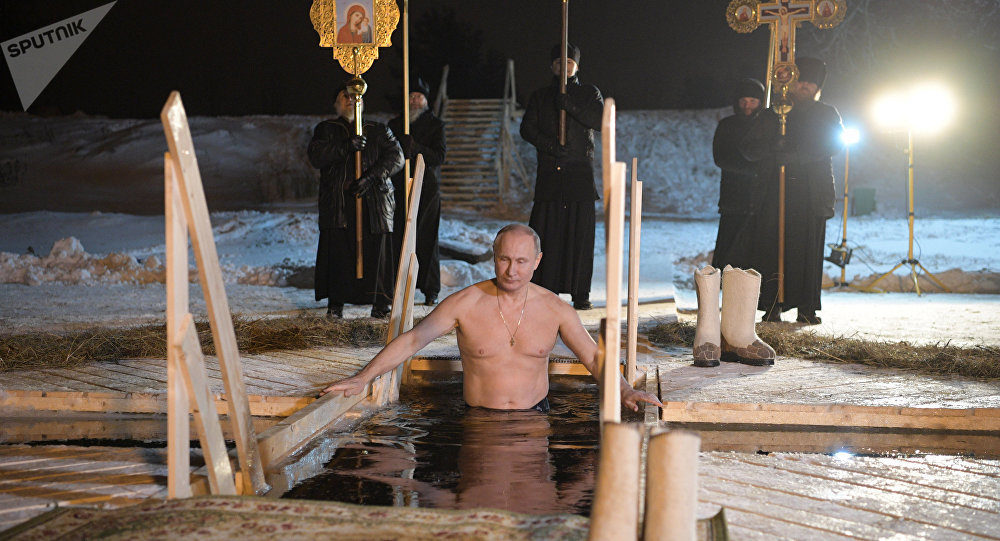 Click to enlarge Putin Bathes in Icy Waters on Day Marking Baptism of Christ