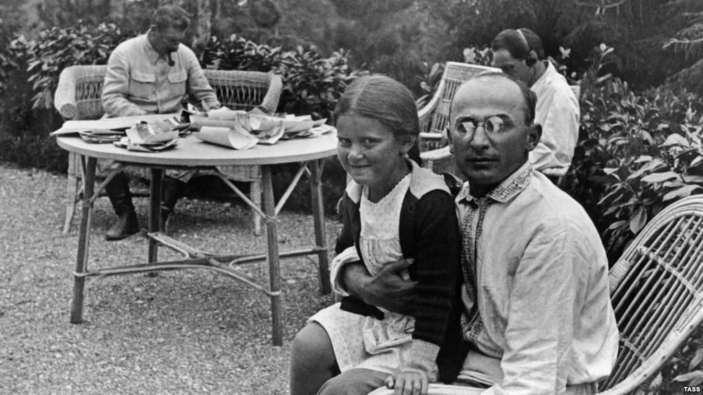 Click to enlarge Former Soviet secret police chief Lavrenty Beria (right) holds Svetlana, the daughter of Soviet dictator Josef Stalin (left)