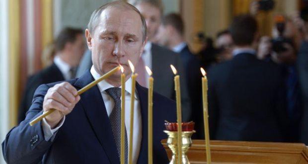 Click to enlarge Putin in church