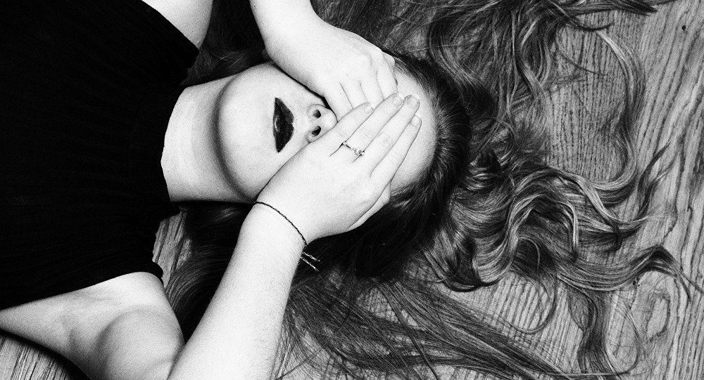 women with hands over eyes