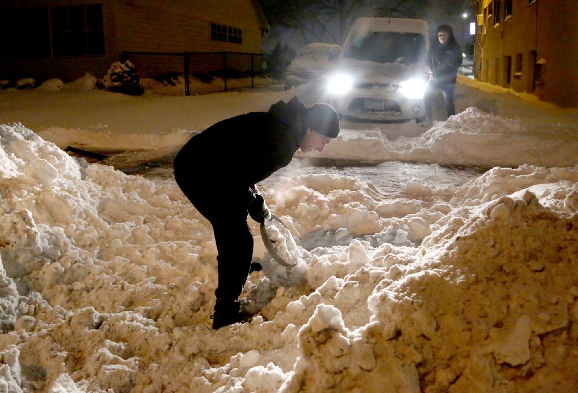 Click to enlarge The morning after a large snowstorm dumped about a foot of snow on Minneapolis, good samaritan Doug Milek took over shoveling with a large fry pan
