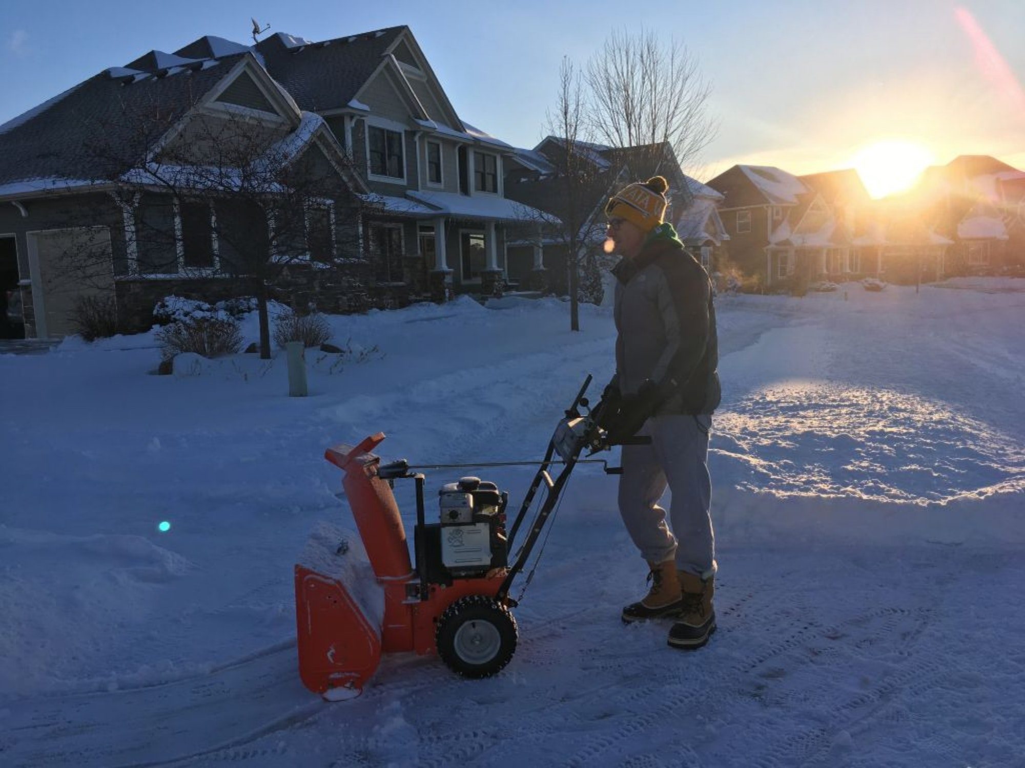 Click to enlarge Mike Schlecht cleaned off his property in Maple Grove on Tuesday for the second time after a snowstorm dumped several inches over the metro area.