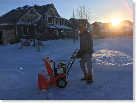 Mike Schlecht cleaned off his property in Maple Grove on Tuesday for the second time after a snowstorm dumped several inches over the metro area.