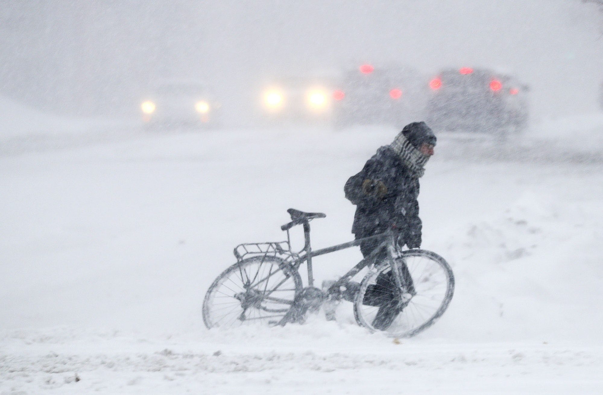 As the snow piled up in downtown St. Paul, this biker seemed to be caught a little off guard as he tried to navigate across W. 7th Street.