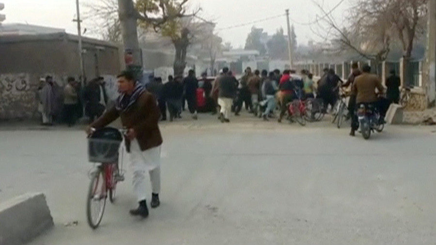 Click to enlarge People run away from a site of a blast