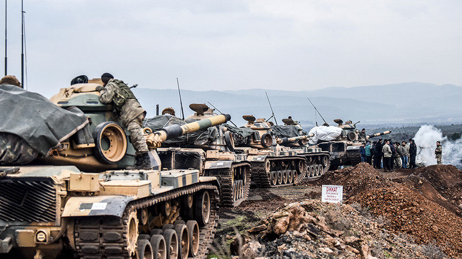 Turkish army troops gather near the Syrian border at Hassa