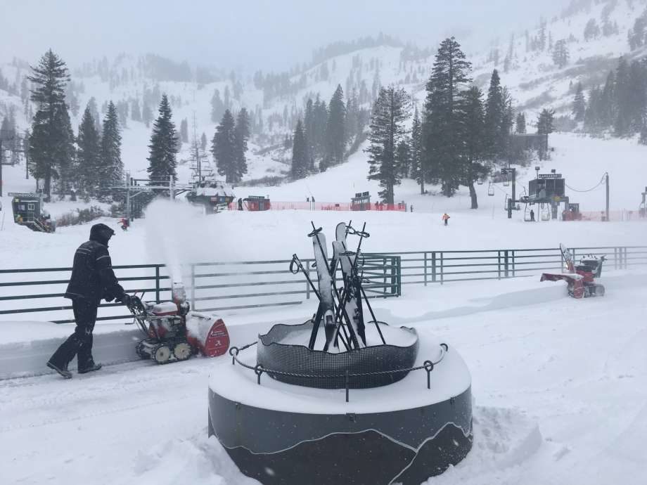 Click to enlarge Employees dig out Alpine Meadows on January 25, 2018 after receiving over a foot of snow.