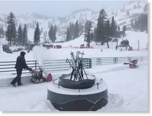 Click to enlarge Employees dig out Alpine Meadows on January 25, 2018 after receiving over a foot of snow.