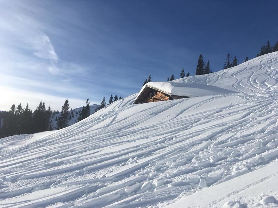 It appears Kitzbuhel measure their snow depth at a point not next to some of their mountain huts, with have been largely buried by the snow.