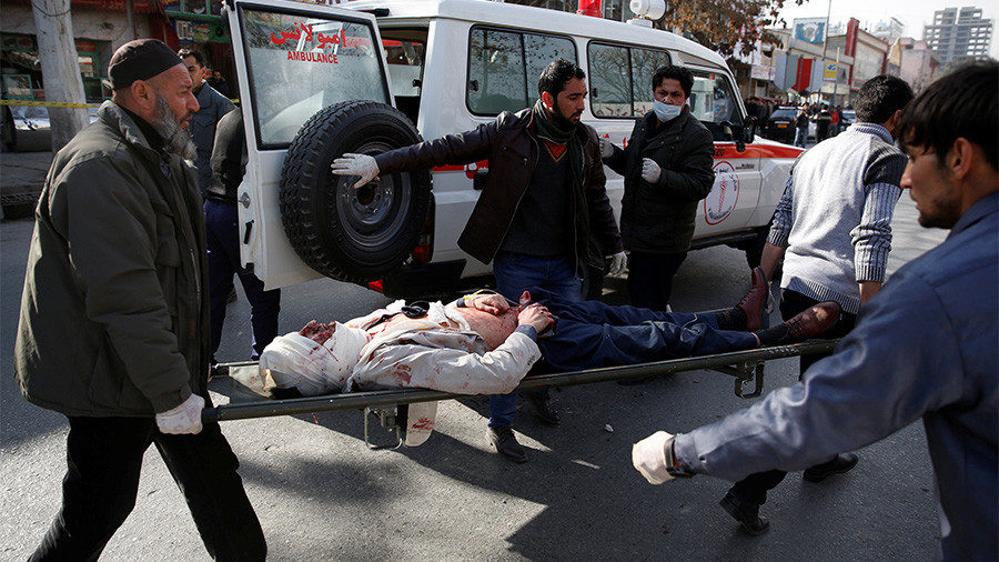 People carry an injured man