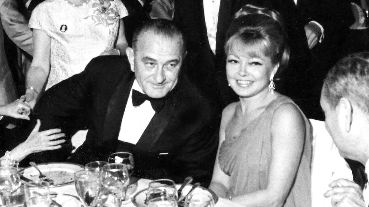 Johnson with Mathilde Krim, at dinner, undated photograph