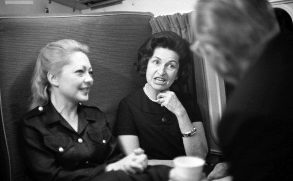 Click to enlarge Mathilde Krim and Lady Bird Johnson with President Johnson in a helicopter en route to the LBJ Ranch from the Krim Ranch, November 1966