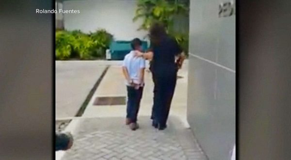 Click to enlarge Boy handcuffed