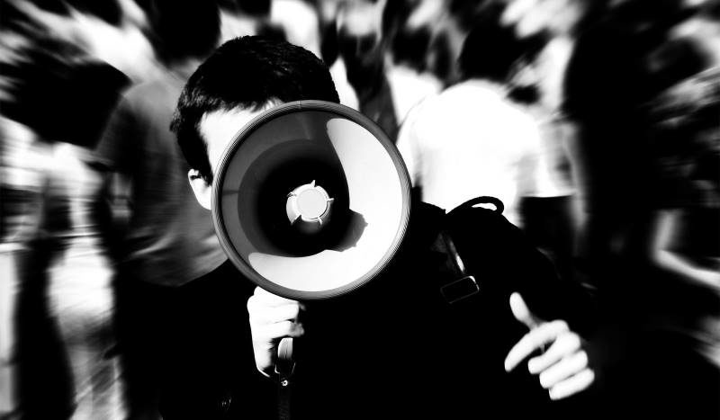 Click to enlarge protestor bullhorn