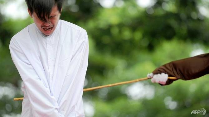 Click to enlarge Indonesia transgender arrested man training