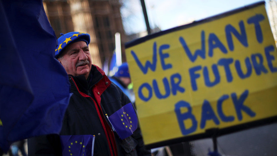 An anti-Brexit protester demonstrates opposite the Houses of Parliament in London