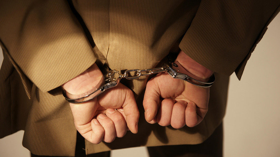 Click to enlarge handcuffed man