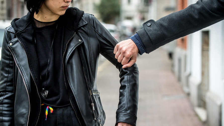 Click to enlarge grabbing woman's arm